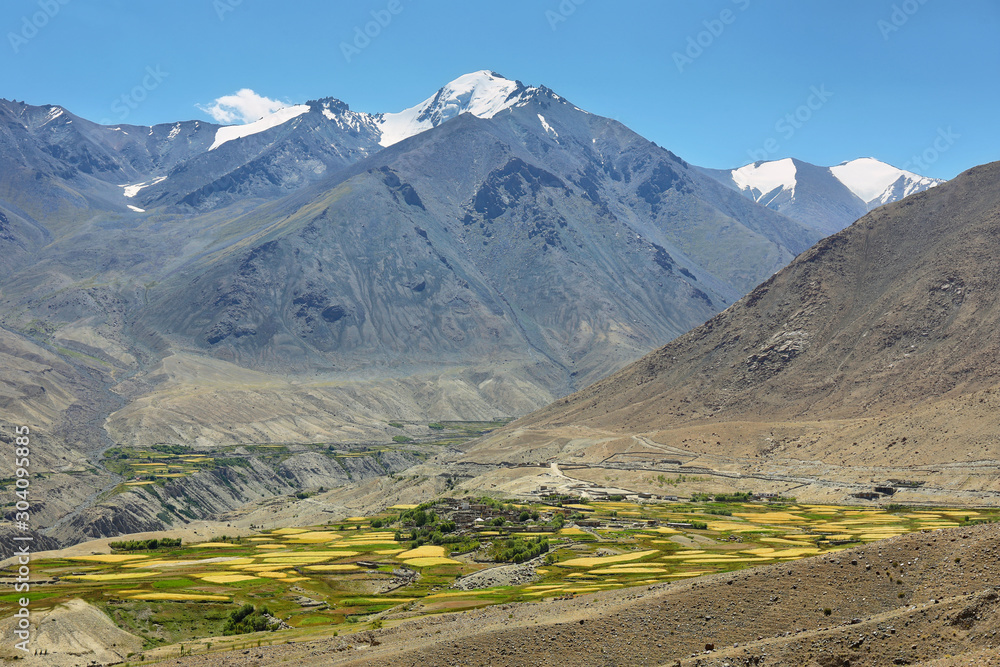 Mountain range of Himalayas and meadows in Nubra valley from Khardung La Pass road