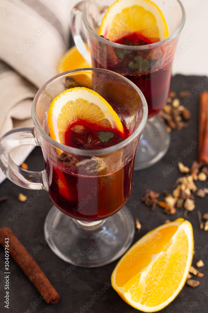 mulled wine of red wine and spices and orange on the table mulled wine of red wine and spices and orange on the table