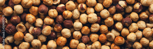 Peeled roasted hazelnut panorama.View from above. Wide. photo