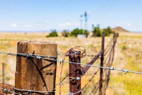 Photography Windmill on a farm in rural grassland area of South Africa