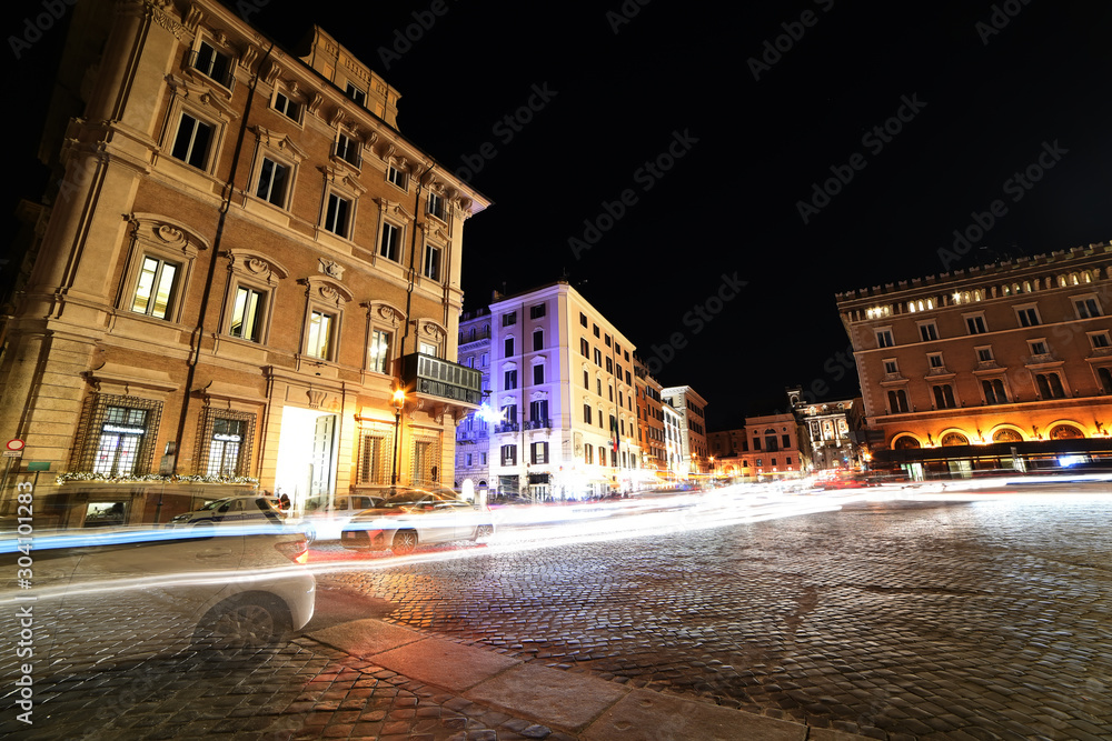 night streets and the area of Rome. blurry moving cars. Rome. Europe.