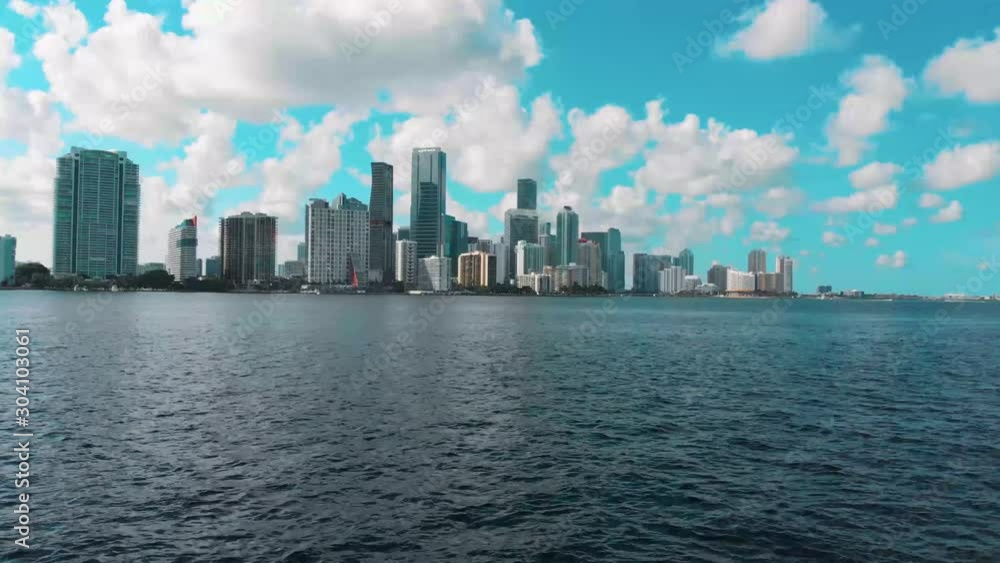 Drone flying towards Brickell skyline over water in Miami Drone flying towards Brickell skyline over water in Miami