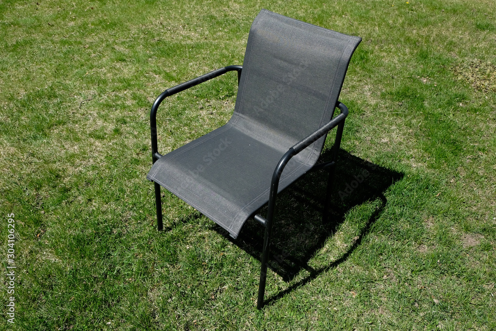 A garden chair on the lawn of the inner courtyard