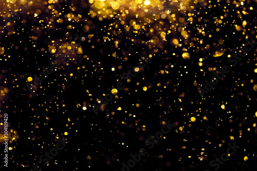 Fotografia, Obraz golden glitter bokeh lighting texture Blurred abstract background for birthday,