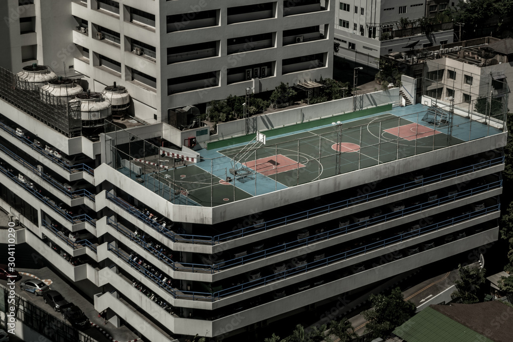 Aerial of colorful basketball courts on the rooftop of a Parking lot  building in bangkok. Stock Photo | Adobe Stock