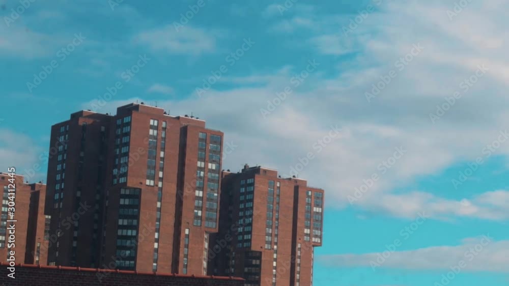 timelapse of buildings in New York with clouds going overhead timelapse of buildings in New York with clouds going overhead