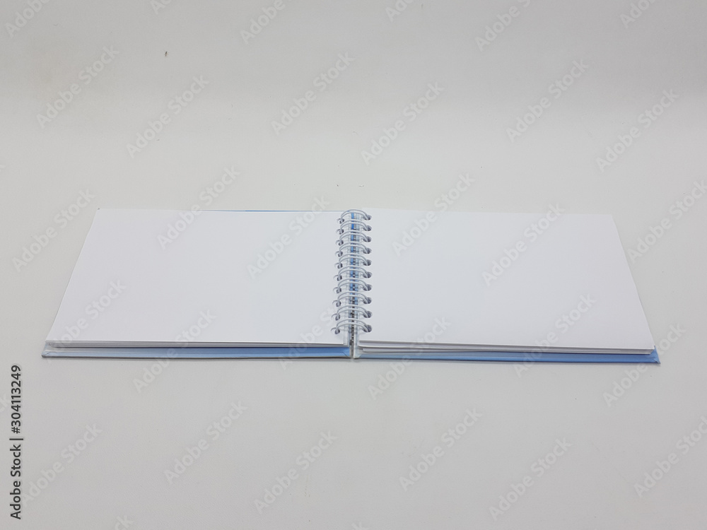 Elegant Beautiful Colorful Blue Design Empty Writing Notebook for Office Business Supplies Tools in White Isolated Background Elegant Beautiful Colorful Blue Design Empty Writing Notebook for Office Business Supplies Tools in White Isolated Background