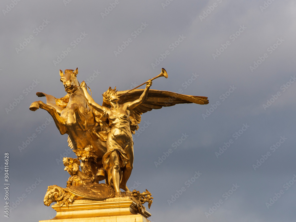 Fototapeta premium Golden herald against dramatic sky