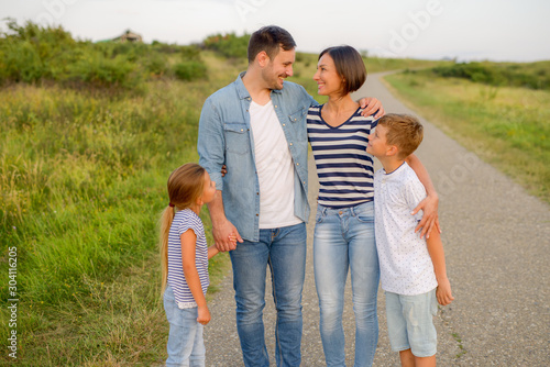 Shot of a family of four enjoying a sunny day in the nature © bugarskipavle3