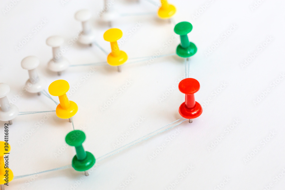 Leader, leadership concept. Red pin with other in connection. Сommunication chain, team structure. Leader, leadership concept. Red pin with other in connection. Сommunication chain, team structure.