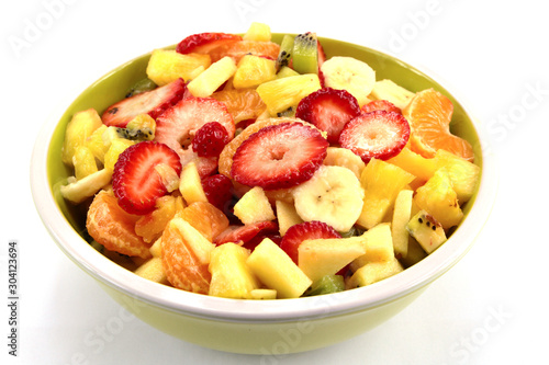 plate of fresh fruit salad on a white background