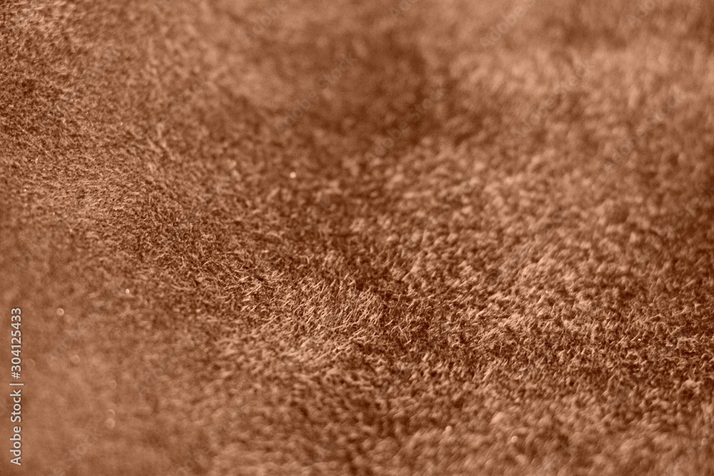 Suede. The texture of the skin is natural. Background of brown. Suede. The texture of the skin is natural. Background of brown.
