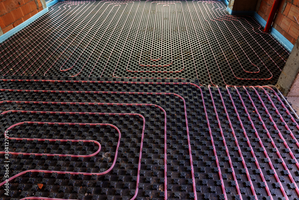 Underfloor heating system installation. Close up on water floor heating