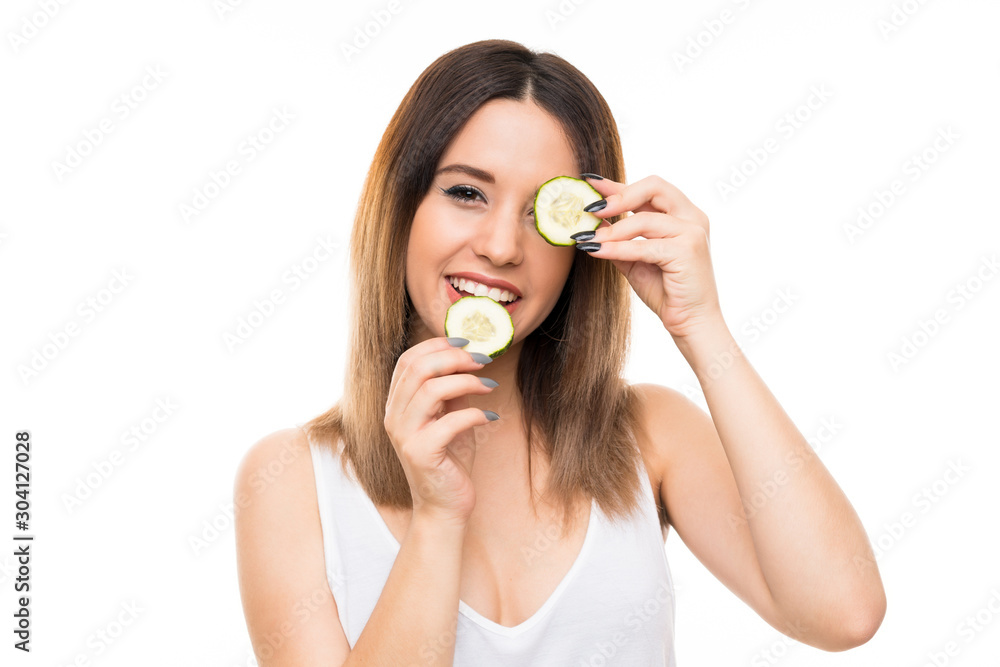Beautiful young woman holding slices of cucumber Beautiful young woman holding slices of cucumber