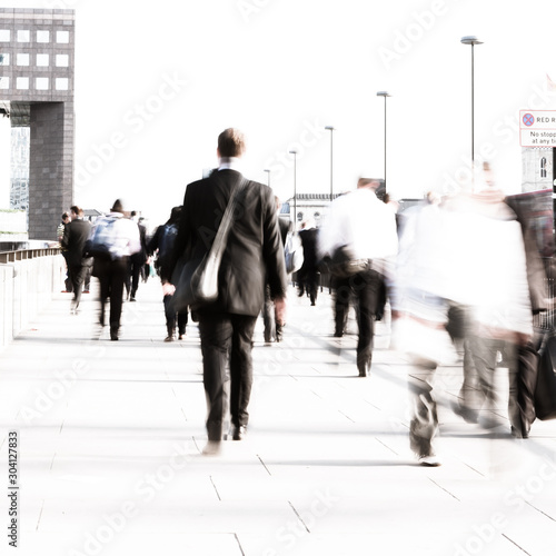 Rush hour commuters. Long exposure, high key abstract blur of anonymous London City workers on their way to the office.