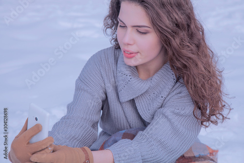 Winter selphie. Portrait of young beautiful woman  make photoshut herself. photo