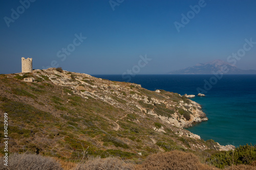 panaoramic view to the ancient Drakano tower and the island of Samos in the background photo