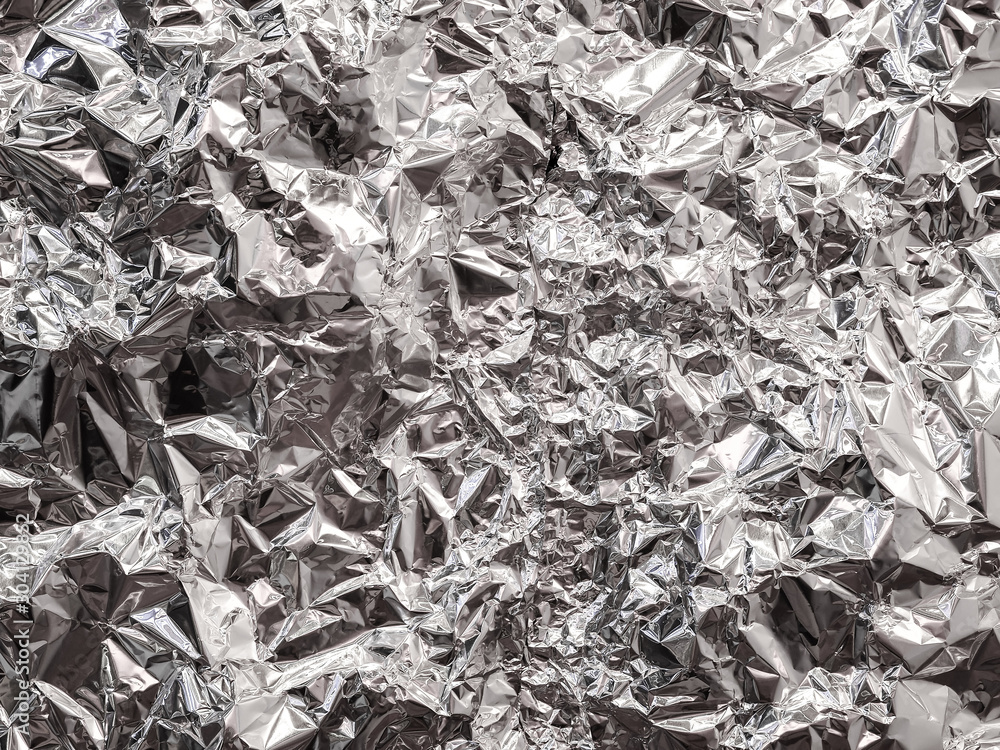 Abstract of aluminum foil texture background for design. Metallic foil paper background. Abstract of aluminum foil texture background for design. Metallic foil paper background.