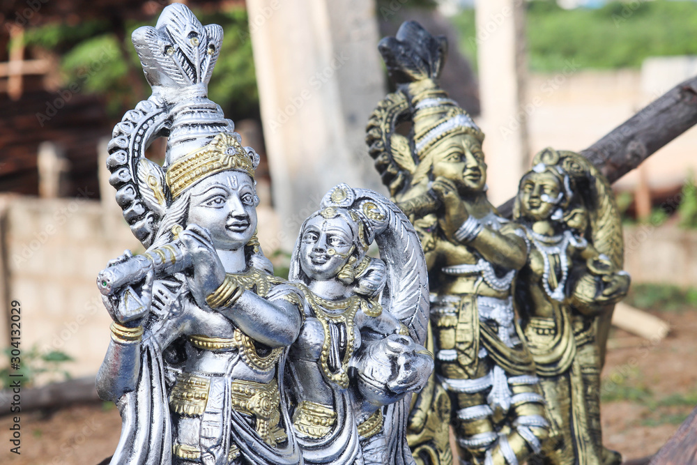 Statue art of Lord Krishna Playing Flute and Radha in Silver and Gold