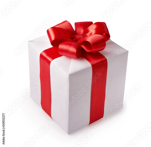 Beautiful white gift box with red bow. Happy Women's Day or Christmas and New Year's Day.