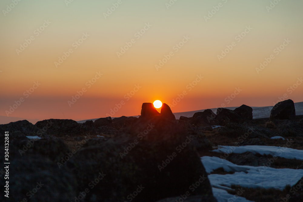 rocks with sun at the sunset
