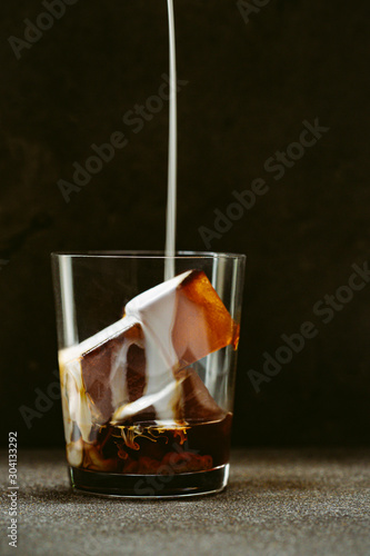 Wallpaper Mural Cream pouring on ice coffee in glass Torontodigital.ca