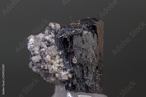 macro mineral Acanthite stone on a black background photo