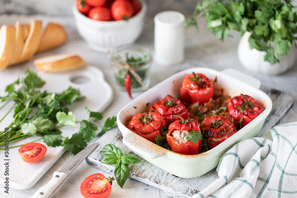 Stuffed red peppers with tomatoes and herbs cooked in the oven. Step by step recipe from several photos. On white background. Stuffed red peppers with tomatoes and herbs cooked in the oven. Step by step recipe from several photos. On white background.