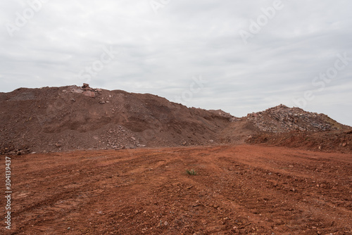 Earthwork gravel space background view stacked into hills