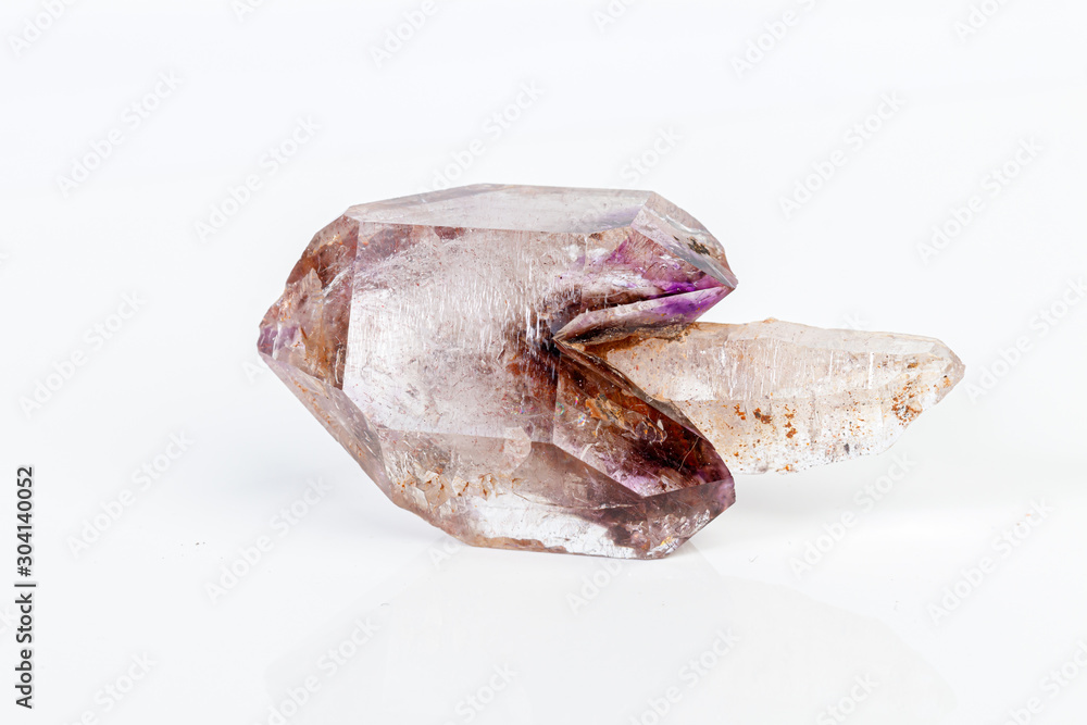 macro mineral stone Amethyst on smoky quartz on a white background macro mineral stone Amethyst on smoky quartz on a white background