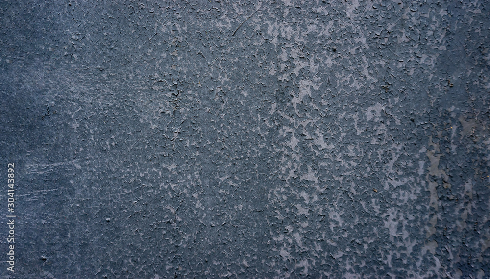 Defocused abstract background. Old cracked stucco of blue tones on the wall. Soft gradient. Defocused abstract background. Old cracked stucco of blue tones on the wall. Soft gradient.