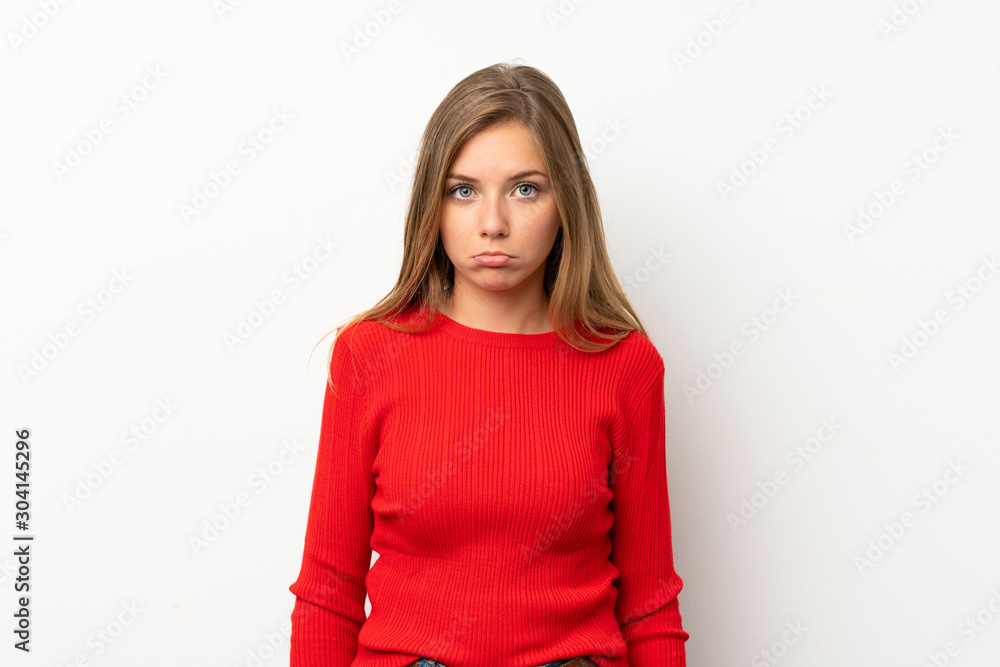 Young blonde woman with red sweater over isolated white background sad Young blonde woman with red sweater over isolated white background sad