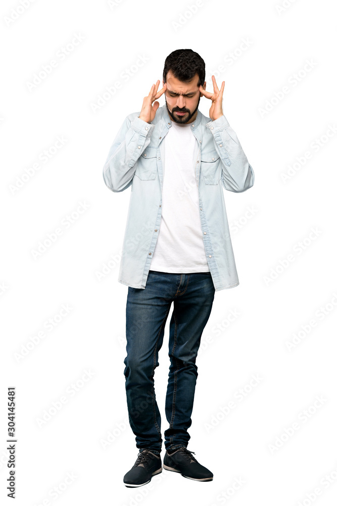 Full-length shot of Handsome man with beard with headache over isolated white background Full-length shot of Handsome man with beard with headache over isolated white background