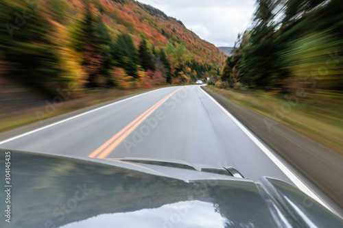 Winding road in the fall with motion blur © Andrew