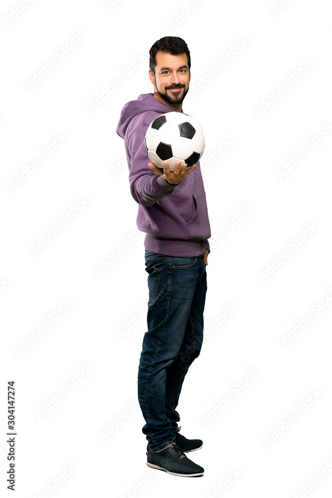 Handsome man with sweatshirt holding a soccer ball Handsome man with sweatshirt holding a soccer ball