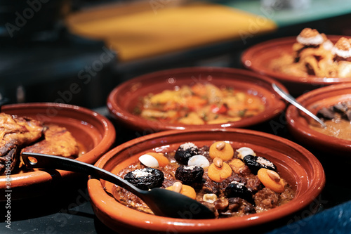 Photos Meat tajine is a moroccan dish in sauce with dried fruits like prunes, apricot a