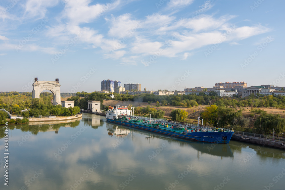 Volgograd. Russia-September 14, 2019. The cargo ship leaves the gate of the first lock of the Volga-Don Shipping Canal named after V.I. Lenin's late fall