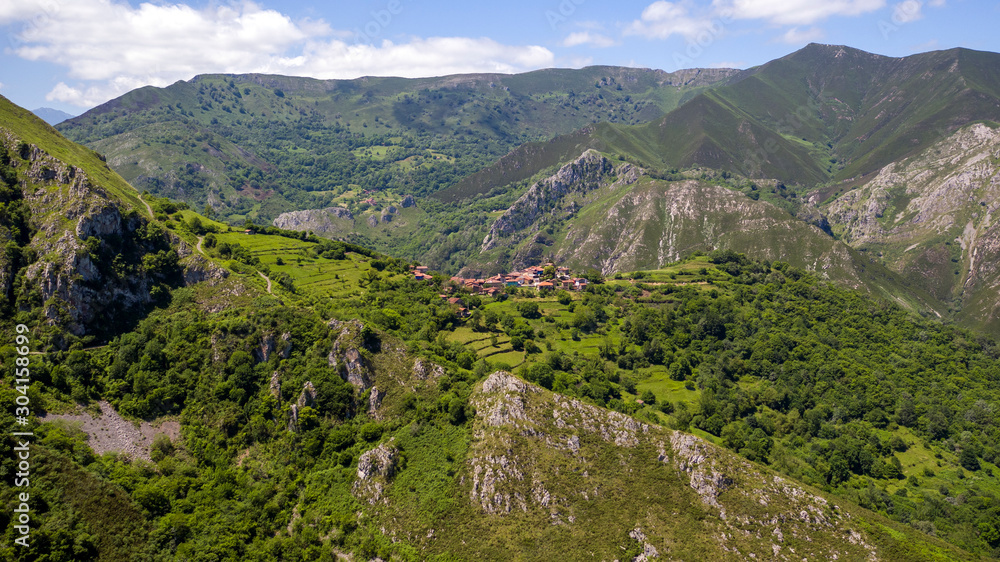 aerial view of mountains and village
