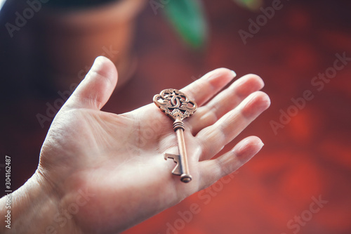 woman hand vintage key