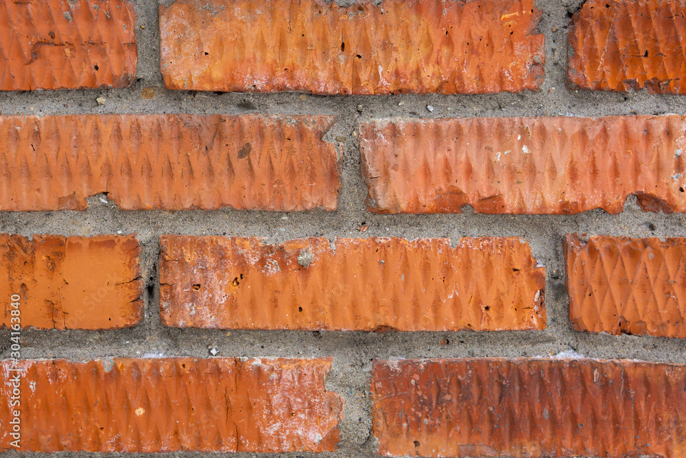 Abstract background in the form of an old brickwork of brown color and a metal stove rusty door close-up. Abstract background in the form of an old brickwork of brown color and a metal stove rusty door close-up.