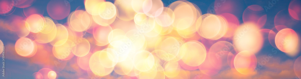 Abstract banner background image of sunset or sunrise sky with warm colors lens flare bokeh - obrazy, fototapety, plakaty 