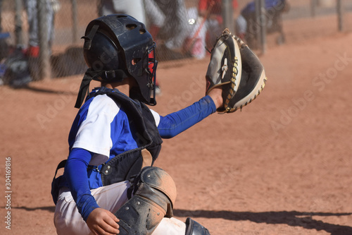 Photography youth baseball catcher in blue and white