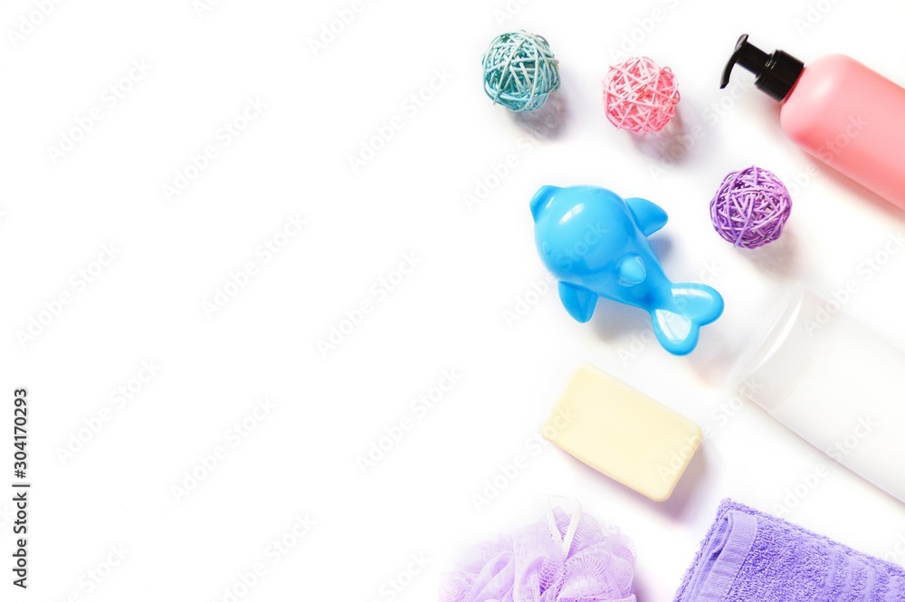 Flat lay photography baby care cosmetics. Shampoo, liquid soap and toy Flat lay photography baby care cosmetics. Shampoo, liquid soap and toy