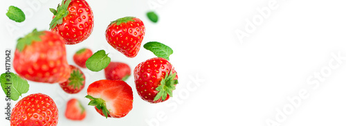 Fototapeta Naklejka Na Ścianę i Meble -  Falling berries strawberry on white background. Flying berries pattern. Background of fresh strawberry on white background. Creative food concept. Long web format with copy space
