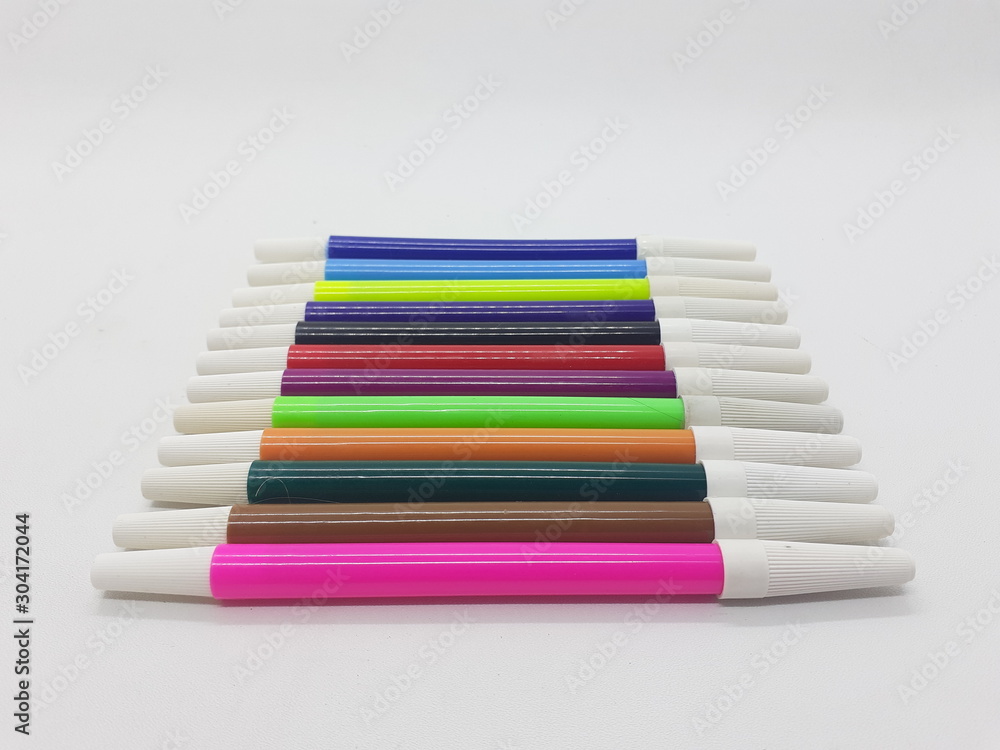 Fototapeta premium Beautiful Colorful Artistic Pens for Coloring and Drawing Tools in White Isolated Background