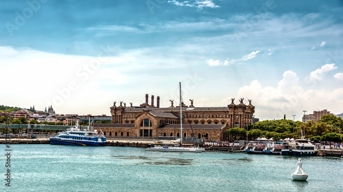The Building of Old Customs House in the port of Barcelona. View from the sea photo