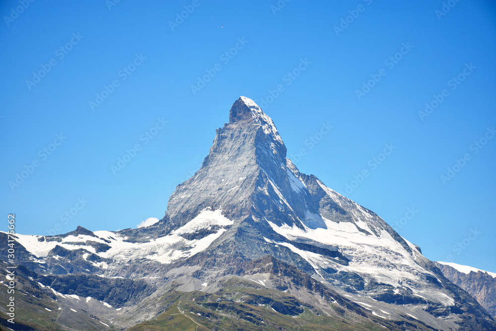 Matterhorn on a perfectly clear blue sky (with an airplane cutting the tip), Matterhorn, Switzerland