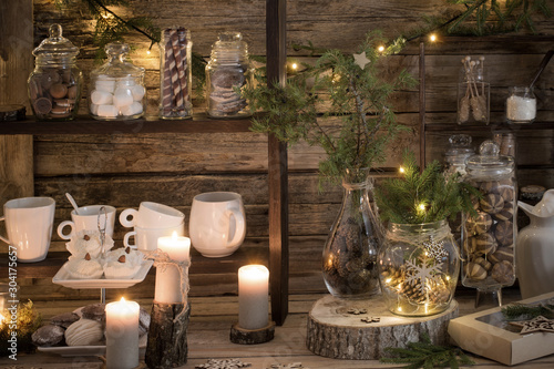 Christmas decoration cocoa bar with cookies and sweets on old wooden background in natural rustic style. Winter cozy concept
