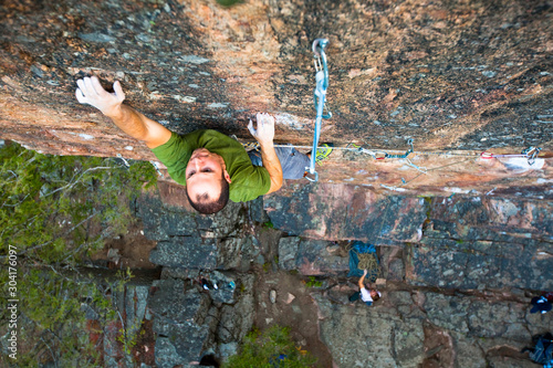 A man on his wicked hard project Hyper Cube (5.14b?) in Gallatin Canyon.