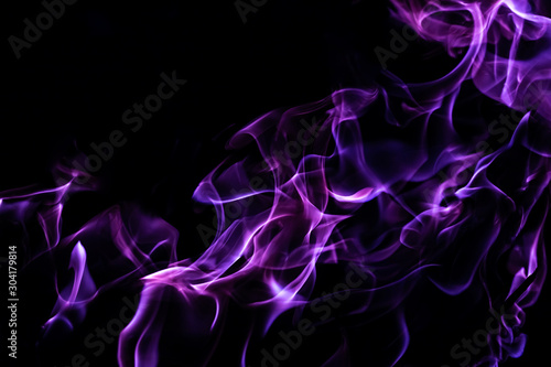 Violet fire forms abstraction in black background